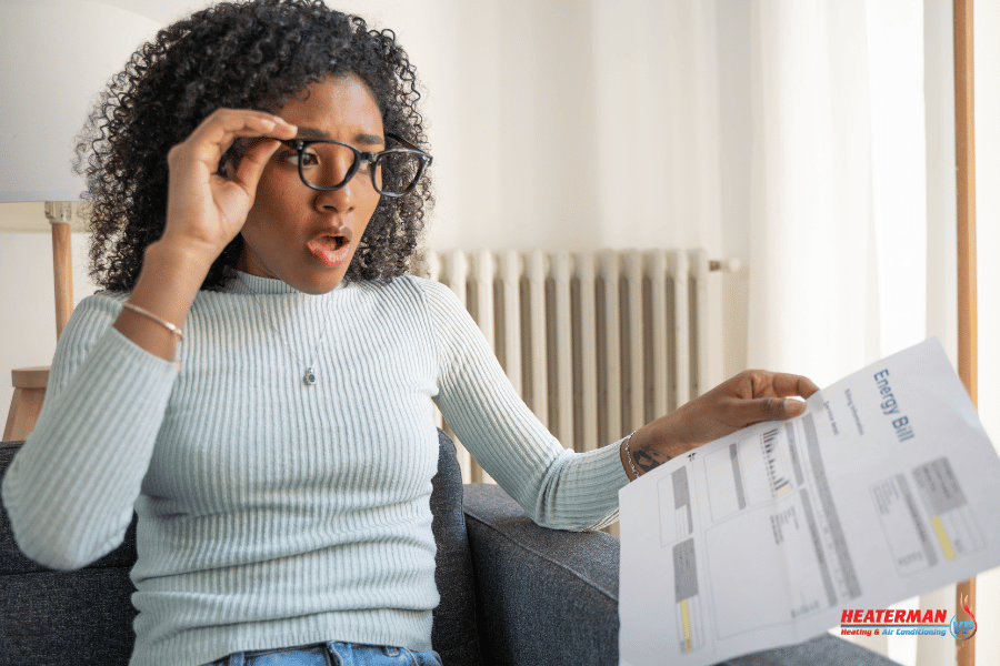 A women shocked at her cooling bills in Suffolk County