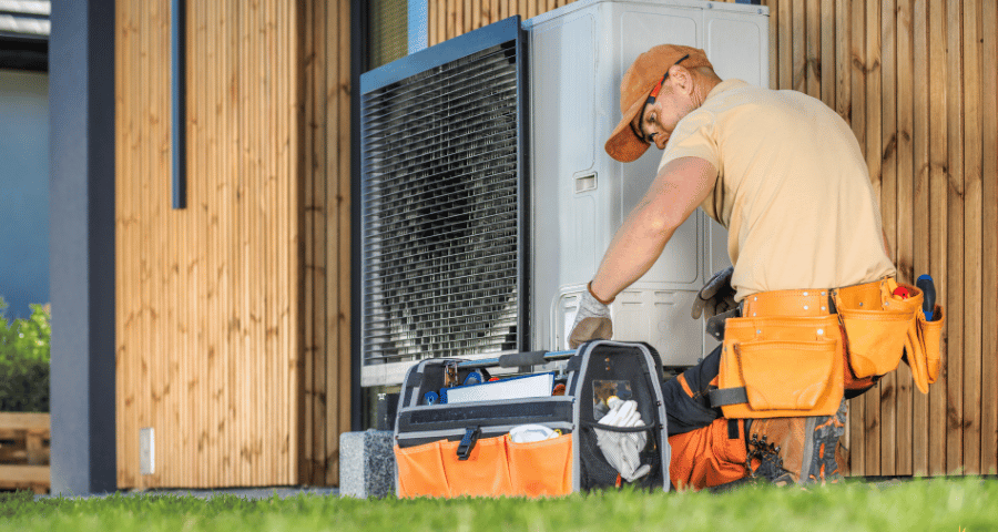 HVAC technician working on heating system in Suffolk County